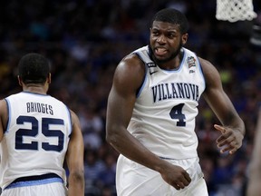 Villanova's Eric Paschall (4) reacts during the first half in the semifinals of the Final Four NCAA college basketball tournament against Kansas, Saturday, March 31, 2018, in San Antonio.