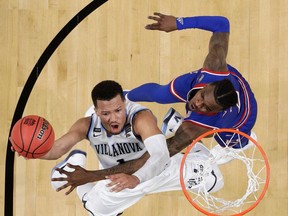 Villanova's Jalen Brunson (1) shoots over Kansas's Lagerald Vick (2) during the second half in the semifinals of the Final Four NCAA college basketball tournament, Saturday, March 31, 2018, in San Antonio.