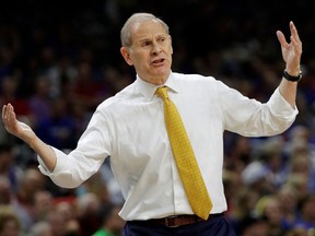Michigan head coach John Beilein reacts to a call during the first half against Loyola-Chicago in the semifinals of the Final Four NCAA college basketball tournament, Saturday, March 31, 2018, in San Antonio.