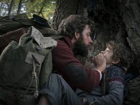 John Krasinski, left, and Noah Jupe in a scene from A Quiet Place.