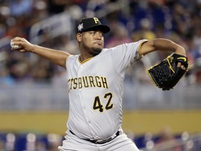 Pittsburgh Pirates starting pitcher Ivan Nova throws during the first inning of a baseball game against the Miami Marlins, Sunday, April 15, 2018, in Miami.