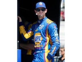 FILE - In this March 10, 2017, file photo, IndyCar driver Alexander Rossi looks on from his pit stand before practicing for the IndyCar St. Petersburg Grand Prix in St. Petersburg, Fla. Graham Rahal loves what he's seeing at the top of the IndyCar series standings so far this season. Twenty-something Americans Alexander Rossi, Josef Newgarden and Rahal are lined up neatly at the top heading into Sunday's, April 22, 2018, race at Barber Motorsports Park.