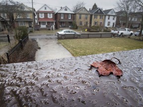 Ice from freezing rain starts to form on a railing in Toronto on Saturday April 14, 2018. Environment Canada has issued a weather warning that up to 20mm or ice build up is possible.