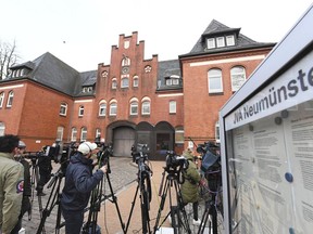 Journalist stand outside the prison in Neumuenster, northern Germany, Friday, April 6, 2018 where former Catalonian leader Carles Puigdemont is expected to be released on bail later the day after he was detained in March.