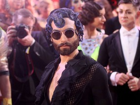 FILE - In this June 10, 2017 file photo Austrian singer Conchita Wurst arrives for the opening ceremony of the Life Ball in front of the City Hall in Vienna, Austria. The Life Ball is a charity gala to raise money for people living with HIV and AIDS.