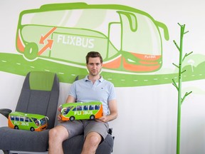 FILE - In this July 10, 2017 file photo the CEO of the bus company Flixbus, Jochen Engert, poses in his office in Munich, southern Germany. European coach service startup FlixBus says it plans to expand into the U.S. market in the coming months, where it will compete with established operators such as Greyhound Lines and Megabus.