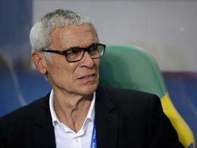 FILE - In this Sunday, Feb. 5, 2017 file photo, Egypt coach Hector Cuper, from Argentina, sits on the bench during the African Cup of Nations final soccer match between Egypt and Cameroon at the Stade de l'Amitie, in Libreville, Gabon.