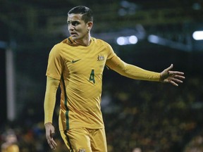 FILE - In this Tuesday, March 27, 2018. file photo, Australia's Tim Cahill walks on the pitch during a friendly soccer match between Colombia and Australia in London.