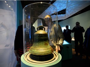 Environment and Climate Change Minister Catherine McKenna, right, and Susan le Jeune d'Allegeershecque, the British High Commissioner to Canada, left, look at the bell from the HMS Erebus during an event at the Canadian Museum of History in Gatineau, Quebec on Thursday, April 26, 2018., to announce that the two shipwrecks of the 1845 Franklin Expedition are now jointly owned by Canada and Inuit through Parks Canada and the Inuit Heritage Trust.