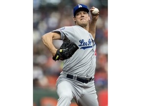 Los Angeles Dodgers starting pitcher Rich Hill throws to a San Francisco Giants batter in the second inning of a baseball game in San Francisco, Saturday, April 7, 2018.