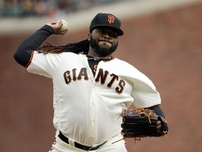 San Francisco Giants starting pitcher Johnny Cueto throws to a Seattle Mariners batter during the first inning of a baseball game Wednesday, April 4, 2018, in San Francisco.
