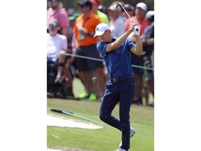 Jordan Spieth is upset with his chip on seven which went long during the second round of the Masters golf tournament at Augusta National Golf Club in Augusta, Ga., Friday, April 6, 2018.
