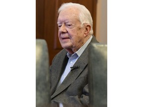 Former President Jimmy Carter, 93, sits for an interview about his new book "Faith: A Journey For All" which will debut at no. 7 on the New York Times best sellers list, pictured before a book signing Wednesday, April 11, 2018, in Atlanta.
