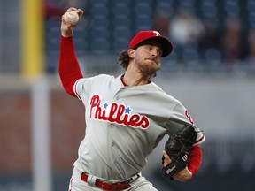 Philadelphia Phillies starting pitcher Aaron Nola (27) works in the first inning of a baseball game against the Atlanta Braves Monday, April 16, 2018, in Atlanta.