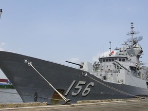 In this Thursday, April 19, 2018, photo, Royal Australian Navy frigate HMAS Toowoomba is docked at Saigon port in Ho Chi Minh City, Vietnam.