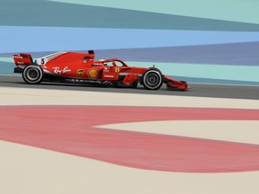 Ferrari driver Sebastian Vettel of Germany steers his car during the first free practice at the Formula One Bahrain International Circuit in Sakhir, Bahrain, Friday, April 6, 2018. The Bahrain Formula One Grand Prix will take place here on Sunday.