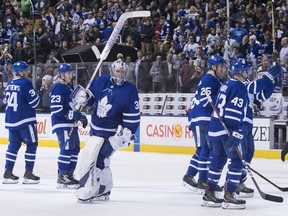 Toronto Maple Leafs players celebrate a win over the Montreal Canadiens on April 7.
