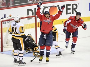 Capitals left wing Alex Ovechkin, centre, says he "can't wait" to get another shot at playing the Penguins in the playoffs.