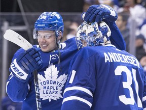 Auston Matthews, left,  congratualtes Frederik Andersen after the Toronto Maple Leafs defeated the Montreal Canadiens to end the regular season on Saturday night.