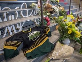 A memorial at the stairs that lead to Elgar Petersen Arena is shown in Humboldt, Sask., on Saturday, April 7, 2018.