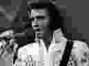 In this undated file photo released by NBC-TV, singer Elvis Presley is shown in concert in the later part of his career. 