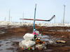 A hockey stick cross marks the place where 15 died in the Humboldt Broncos bus crash, April 9, 2018.