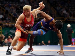 United State's Kyle Dake, left, takes India's Sachin Giri to the mat during their 79 kg match in the Freestyle Wrestling World Cup, Saturday, April 7, 2018, in Iowa City, Iowa.