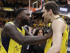 Indiana Pacers' Lance Stephenson, left, celebrates with Bojan Bogdanovic after Indiana defeated the Cleveland Cavaliers 92-90 in Game 3 of a first-round NBA basketball playoff series Friday, April 20, 2018, in Indianapolis.