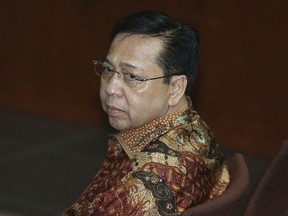 Former Indonesia's Parliament Speaker Setya Novanto sits on the defendant's chair during his sentencing hearing at the Corruption Cases Court in Jakarta, Indonesia, Tuesday, April 24, 2018. The court sentenced the senior politician to 15 years in prison for his role in the theft of $170 million of public money by officials, a victory for anti-corruption police fighting the country's rampant graft.