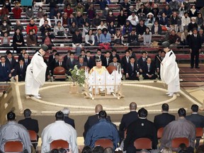 In this Nov. 11, 2017, photo, a Shinto ceremony is held to pray for the safety of sumo wrestlers before the start of the Kyushu Grand Sumo tournament in Fukuoka, southwestern Japan. Nobuyoshi Hakkaku, head of the Japan Sumo Association, apologized Wednesday, April 4, 2018 over an incident in which women first responders were asked to get out of the ring as they attempted to revive an official who collapsed in Maizuru, western Japan.