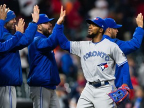 Teoscar Hernandez of the Toronto Blue Jays is congratulated by his teammates after banging out a pair of doubles including the game-winner in his debut for the Jays Friday night at Cleveland's Progressive Field. The Jays fought back from a 4-0 deficit to post an 8-4 win.