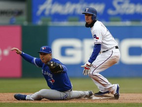 Yangervis Solarte of the Toronto Blue Jays stretches to record the putout on Texas Rangers' Carlos Tocci during MLB action Sunday in Arlington, Texas. The Jays won the rubber match of the series 7-4.