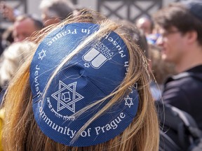 People of different faiths wear the Jewish kippah  during a demonstration against antisemitism in Germany in Erfurt, Germany, Wednesday, April 25, 2018.