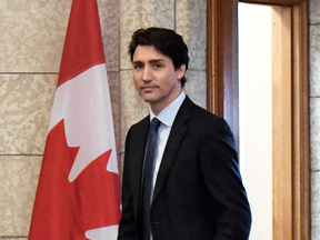 Prime Minister Justin Trudeau leaves his office to attend an emergency cabinet meeting on April 10, 2018.