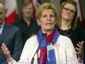 Doug Ford will say "anything about anyone at any time because just like Trump, it is all about him," Kathleen Wynne said on the campaign trail this week.