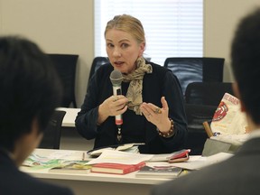 Catherine Fisher of Australia speaks during a meeting with Japanese government officials in Tokyo, Friday, April 6, 2018. Fisher says she was raped by a U.S. sailor in Japan is demanding Tokyo do more to protect victims of U.S. military personnel stationed here.