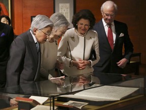 Sweden's King Carl XVI Gustaf, right, Queen Silvia, second from right, Japanese Emperor Akihito, left, and Empress Michiko, second from left, visit Special Exhibition "The Art of Natural Science in Sweden" at JP Tower Museum in Tokyo, Monday, April 23, 2018.