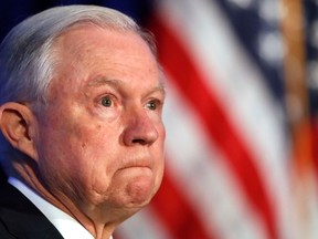 FILE - In this June 20, 2017, file photo, Attorney General Jeff Sessions listens during the Justice Department's National Summit on Crime Reduction and Public Safety, in Bethesda, Md. U.S. Attorney General Sessions has ordered a "zero tolerance" policy aimed at people entering the United States illegally for the first time on the Mexican border. His directive Friday, April 6, 2018, tells federal prosecutors in border states to put more emphasis on charging people with illegal entry, which has historically been treated as a misdemeanor offense for those with few or no previous encounters with border authorities.