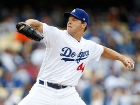 Los Angeles Dodgers starting pitcher Rich Hill delivers against the San Francisco Giants during the first inning of a baseball game Sunday, April 1, 2018, in Los Angeles.