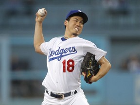 Los Angeles Dodgers starting pitcher Kenta Maeda throws to an Arizona Diamondbacks batter during the first inning of a baseball game Friday, April 13, 2018, in Los Angeles.
