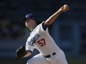 Los Angeles Dodgers starting pitcher Alex Wood throws against the Washington Nationals during the first inning of a baseball game, Sunday, April 22, 2018, in Los Angeles.