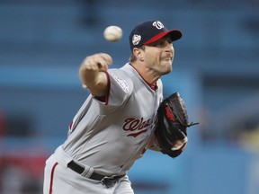 Washington Nationals starting pitcher Max Scherzer throws to a Los Angeles Dodgers batter during the first inning of a baseball game Friday, April 20, 2018, in Los Angeles.