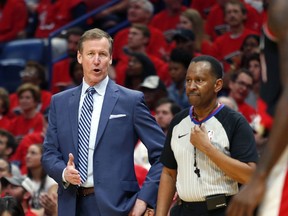 Portland Trail Blazers coach Terry Stotts talks to an official during the first half of Game 4 of a first-round NBA basketball playoff series against the New Orleans Pelicans in New Orleans, Saturday, April 21, 2018.