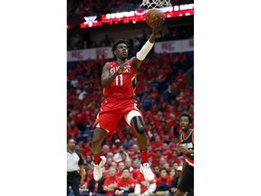 New Orleans Pelicans guard Jrue Holiday (11) goes to the basket during the first half of Game 4 of a first-round NBA basketball playoff series against the Portland Trail Blazers in New Orleans, Saturday, April 21, 2018.
