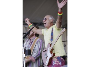 FILE - In this May 3, 2008 file photo, Jimmy Buffett performs during the 2008 New Orleans Jazz & Heritage Festival in New Orleans. Music lovers are converging this week on the Crescent City for the festival, which takes place over two weekends starting on Friday, April 27, 2018, featuring out-of-town artists such as Rod Stewart and Sting, as well as performers from across New Orleans and Louisiana.