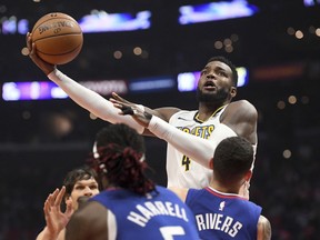 Denver Nuggets forward Paul Millsap shoots against the Los Angeles Clippers during the first half of an NBA basketball game Saturday, April 7, 2018, in Los Angeles.