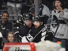 Los Angeles Kings right wing Dustin Brown, right, celebrates his third goal of the NHL hockey game with center Anze Kopitar, of Slovenia, during the second period against the Minnesota Wild on Thursday, April 5, 2018, in Los Angeles.