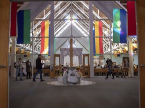 A Humboldt Broncos jersey is displayed in the entrance during morning mass at St. Augustine Church in Humboldt, Sask., on Sunday, April 8, 2018. 15 people traveling with the Humboldt Broncos SJHL hockey team are dead, and many injured when their bus was collided with a semi-trailer 30 kilometres north of Tisdale, Sask.