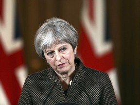 Britain's Prime Minister Theresa May during a press conference in 10 Downing Street, London, Saturday, April 14, 2018. British Prime Minister Theresa May says the need to act quickly and protect "operational security" led her to strike Syria without a prior vote in Parliament.