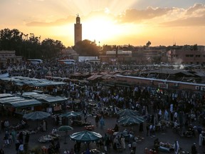 FILE - In this Saturday, Nov. 5, 2016 file photo, people gather in the landmark Jemaa el-Fnaa square, in Marrakesh, Morocco. A FIFA task force arrived in Morocco on Monday, April 16, 2018 to inspect a World Cup bid that obscures one potential impediment to hosting the 2026 soccer showpiece: homosexuality is a criminal offense in the north African country. An Associated Press review of 483 pages of documents submitted to FIFA found Morocco failed to declare its anti-LGBT law as a risk factor and provide a remedy, appearing to flout stringent new bidding requirements.